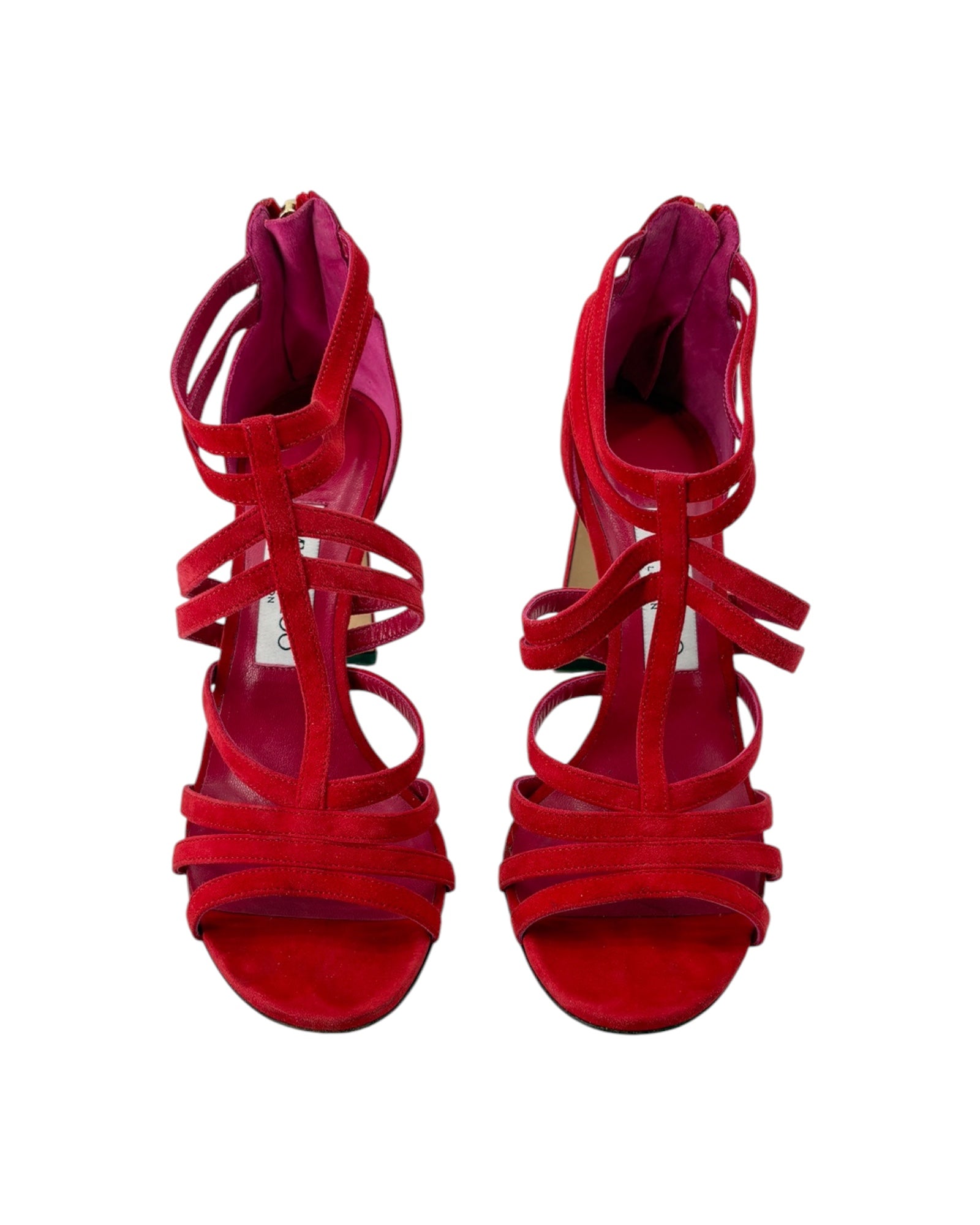 Red high-heeled sandals with strappy design on a white background