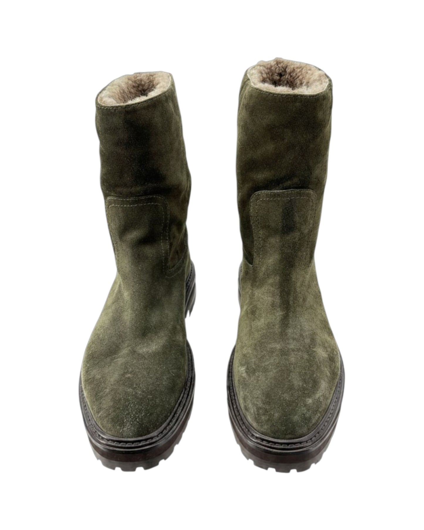 Pair of green suede boots with fur lining on a white background
