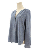 Blue and white striped shirt on a mannequin against a white background