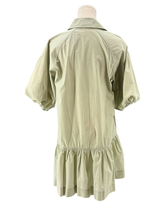Light green dress on a mannequin against a white background