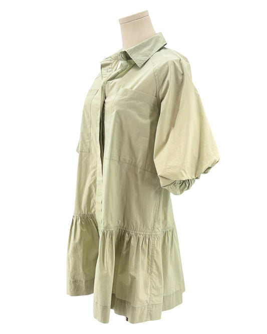Light green dress on a mannequin against a white background