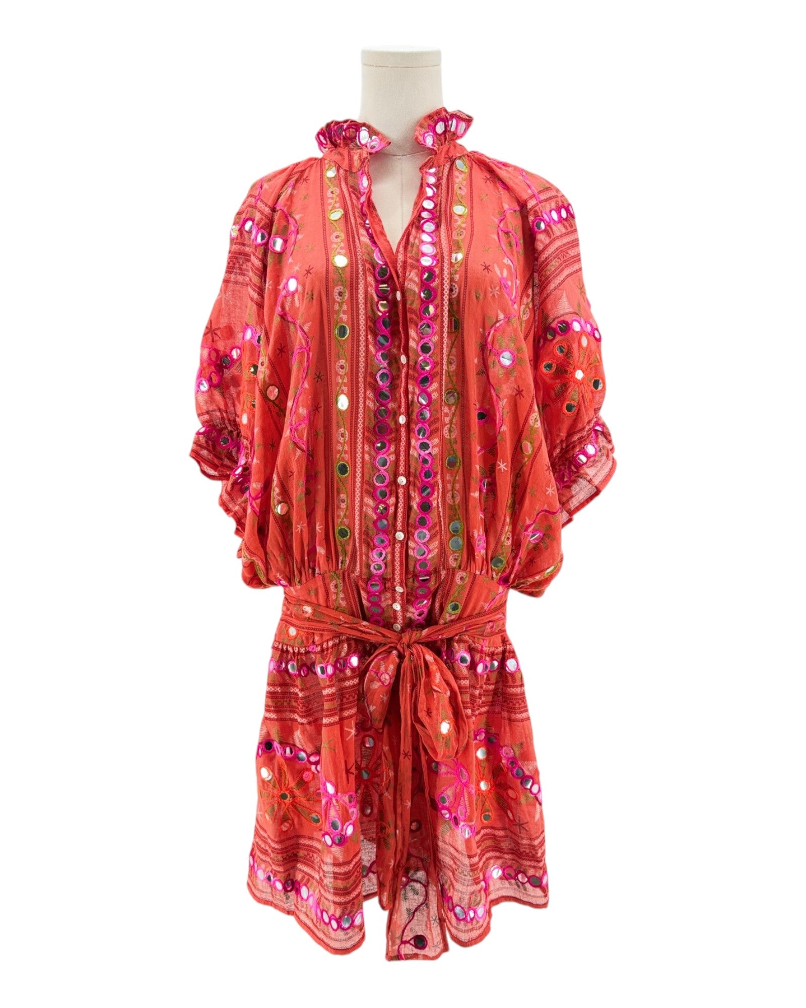 Red patterned dress on a mannequin against a white background