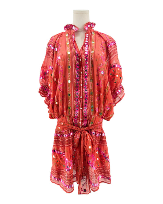Red patterned dress on a mannequin against a white background