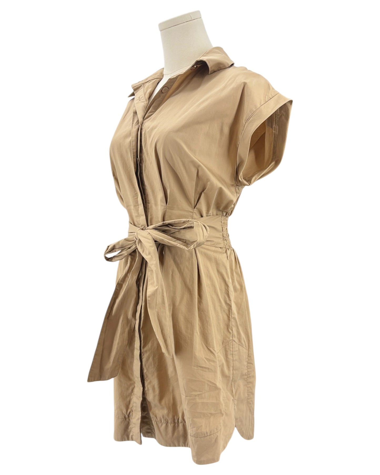 Beige mini dress on a mannequin against a white background