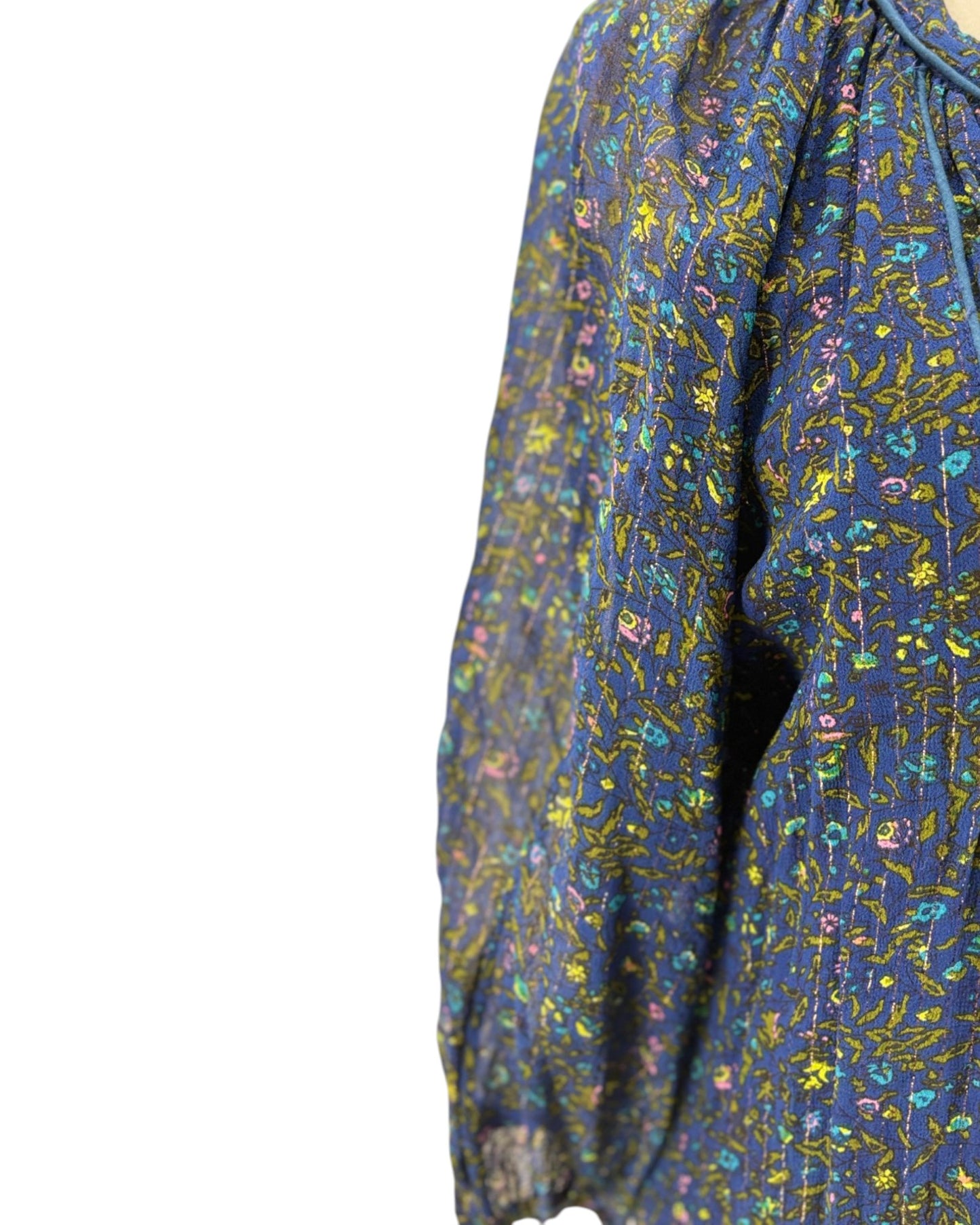 Blue floral patterned blouse on a white background