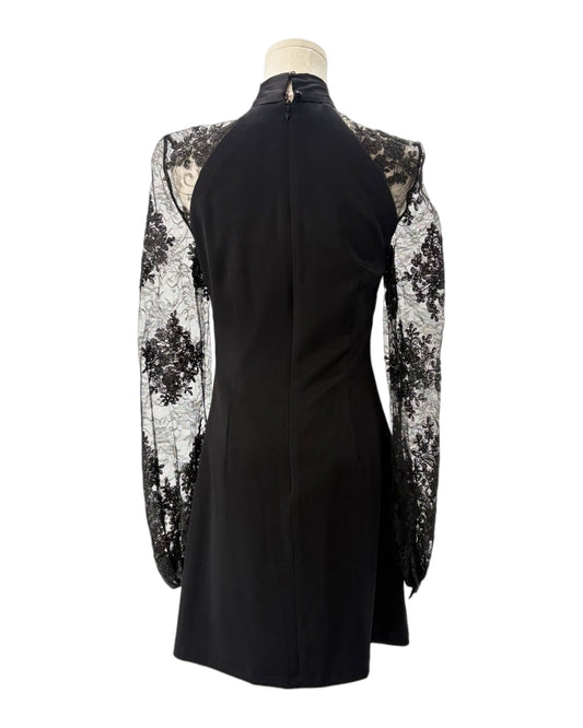 Black dress with floral lace sleeves on a mannequin against a white background