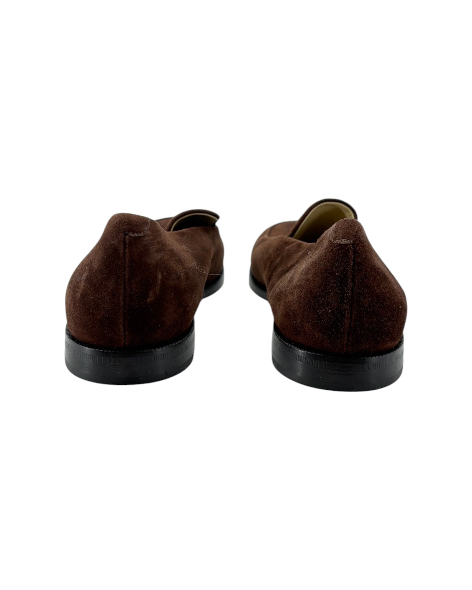 Pair of brown suede shoes on a white background