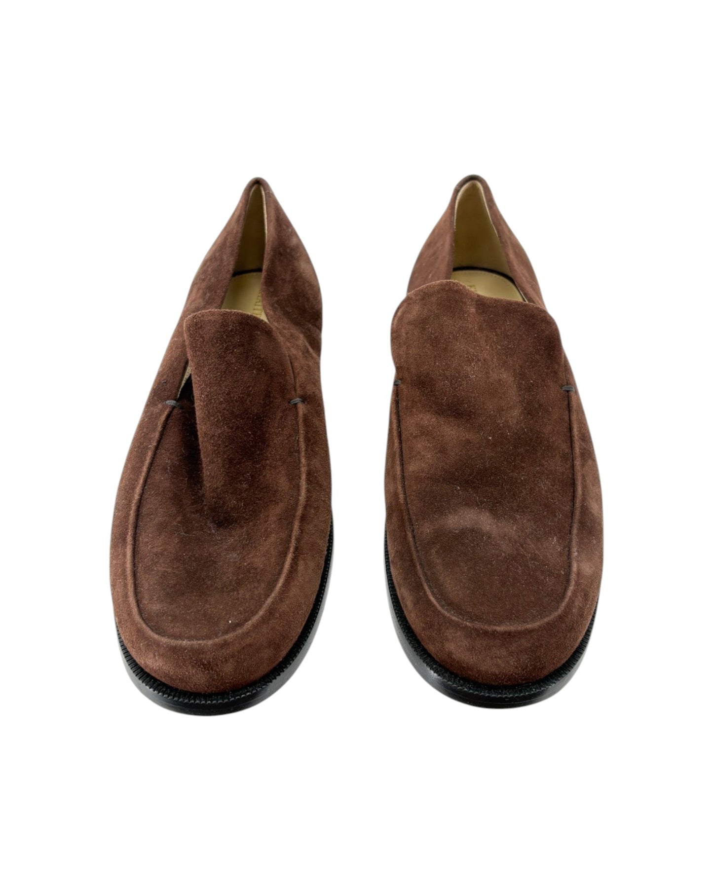 Pair of brown suede loafers on a white background