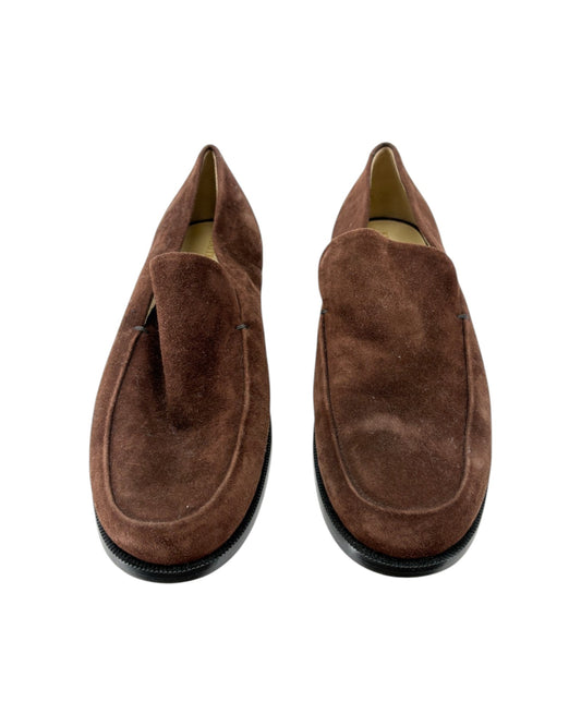 Pair of brown suede loafers on a white background