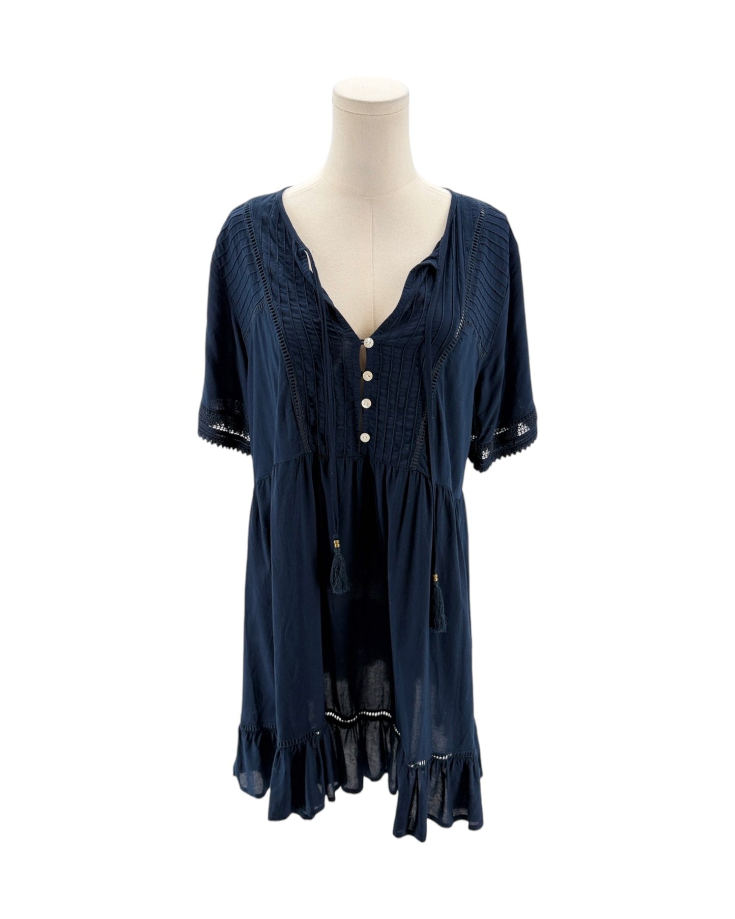 Navy blue dress on a mannequin against a white background