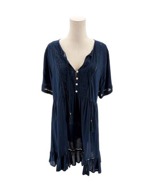 Navy blue dress on a mannequin against a white background