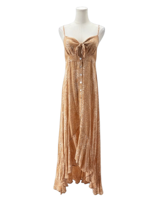 Beige floral dress on a mannequin against a white background