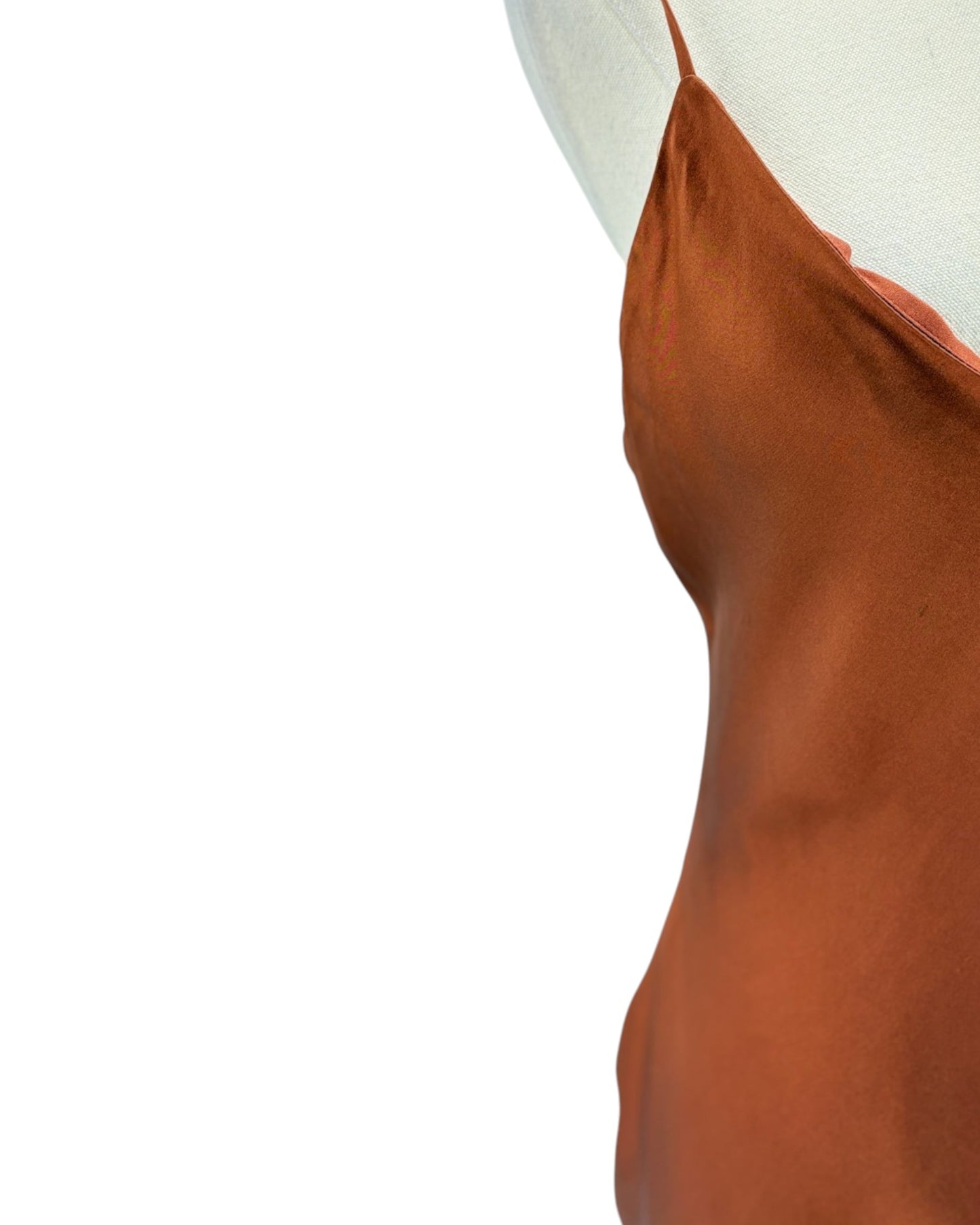 Brown satin slip dress on a mannequin with a white background