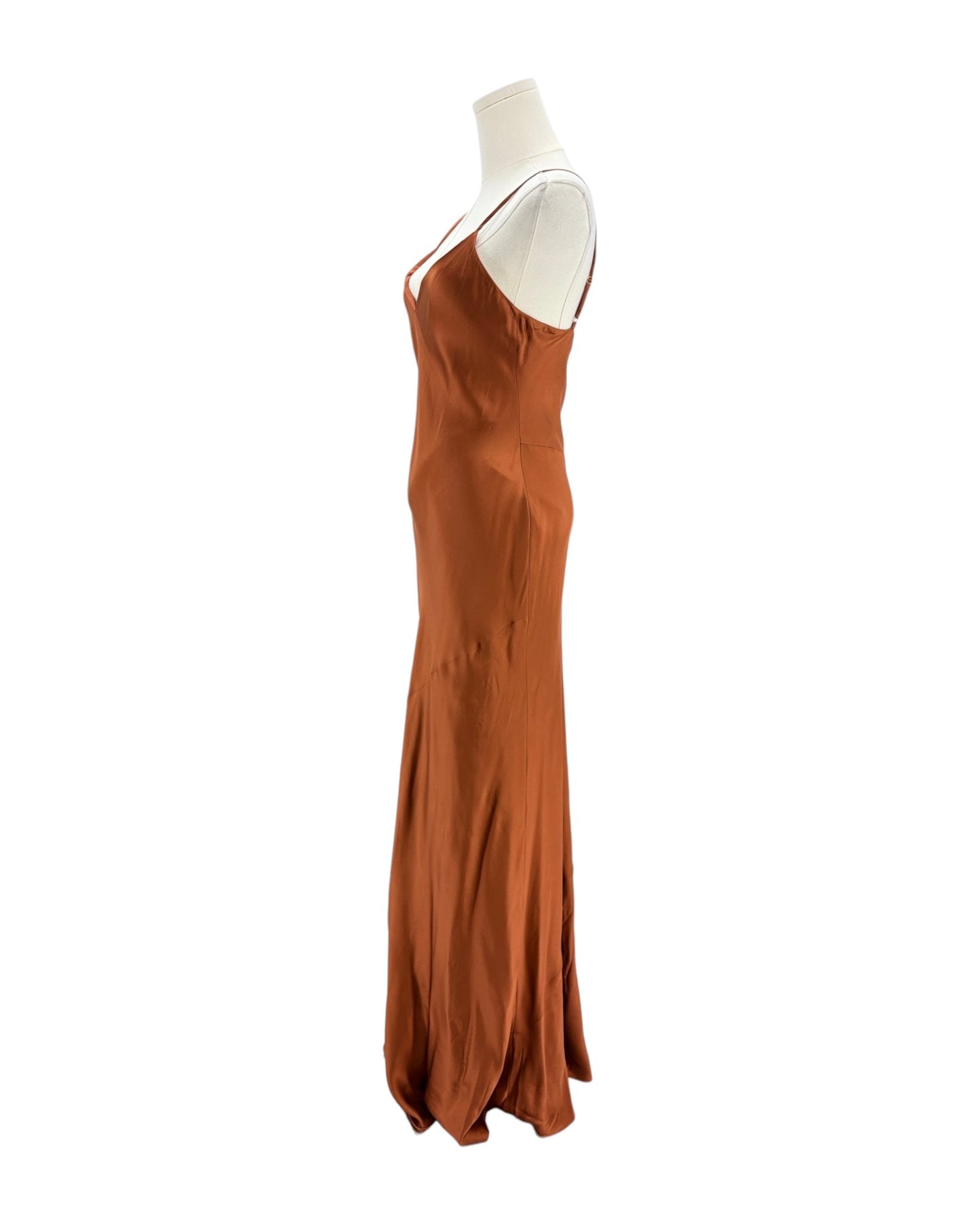 Brown evening gown on a mannequin against a white background
