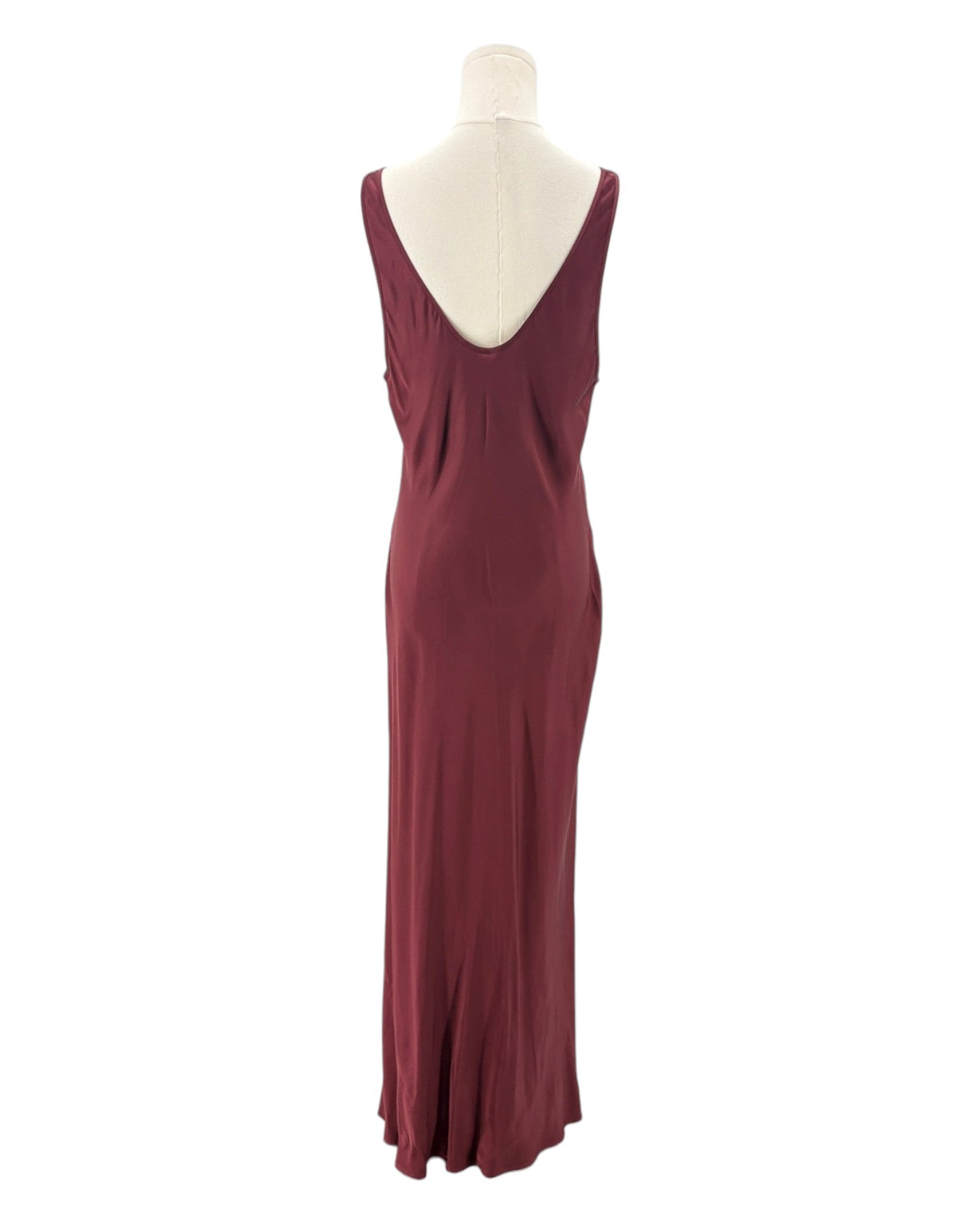 Maroon evening gown on a mannequin against a white background