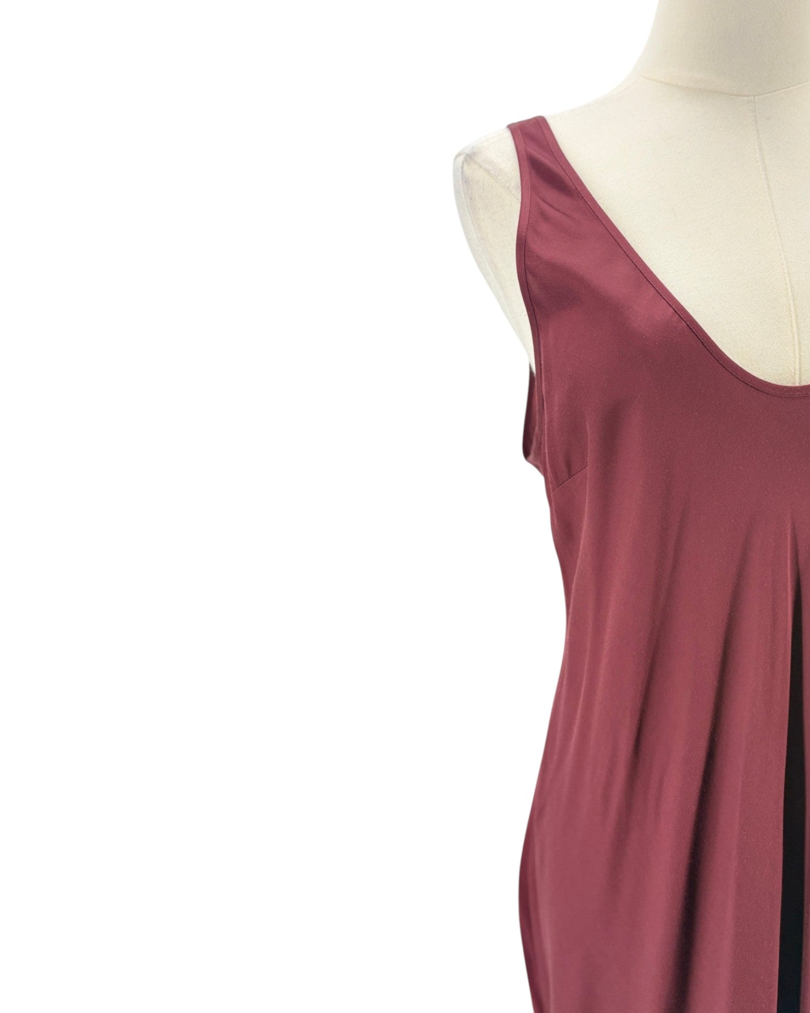 Maroon sleeveless top on a mannequin against a white background
