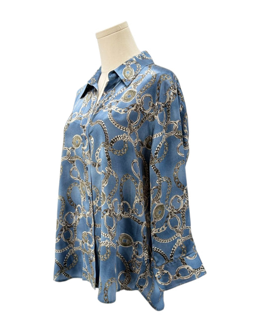 Blue patterned shirt on a mannequin against a white background
