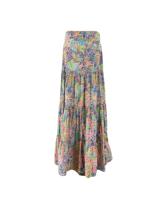 A tiered maxi skirt with a vibrant, multicolor tropical floral and palm leaf print, shown against a plain white background.