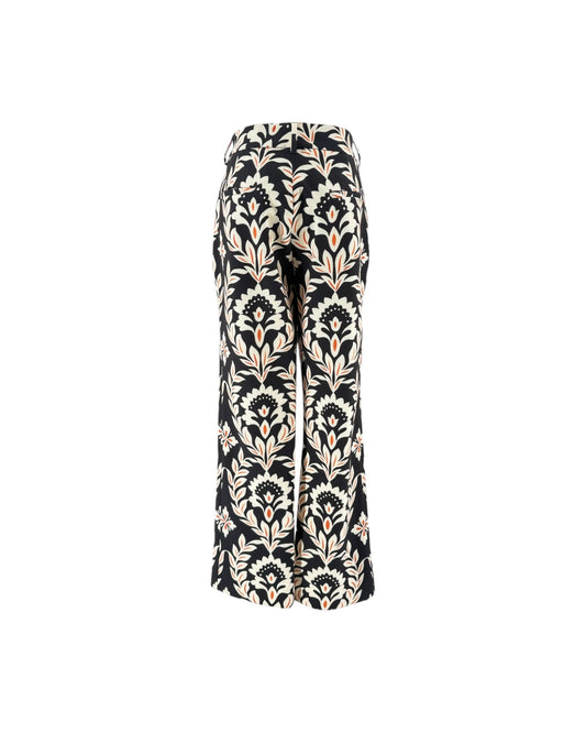 Black wide-leg trousers with a beige and white damask floral pattern, shown against a plain white background.