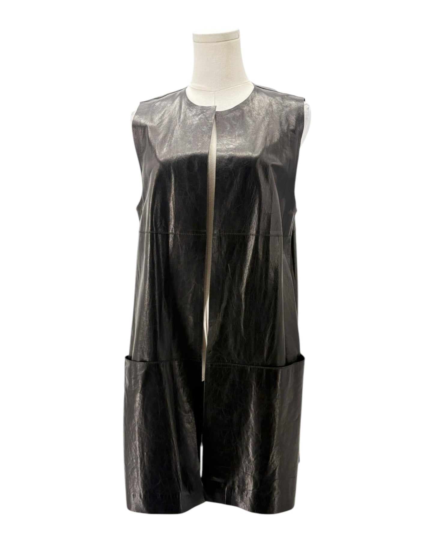 Black sleeveless dress with sheer overlay on a mannequin against a white background