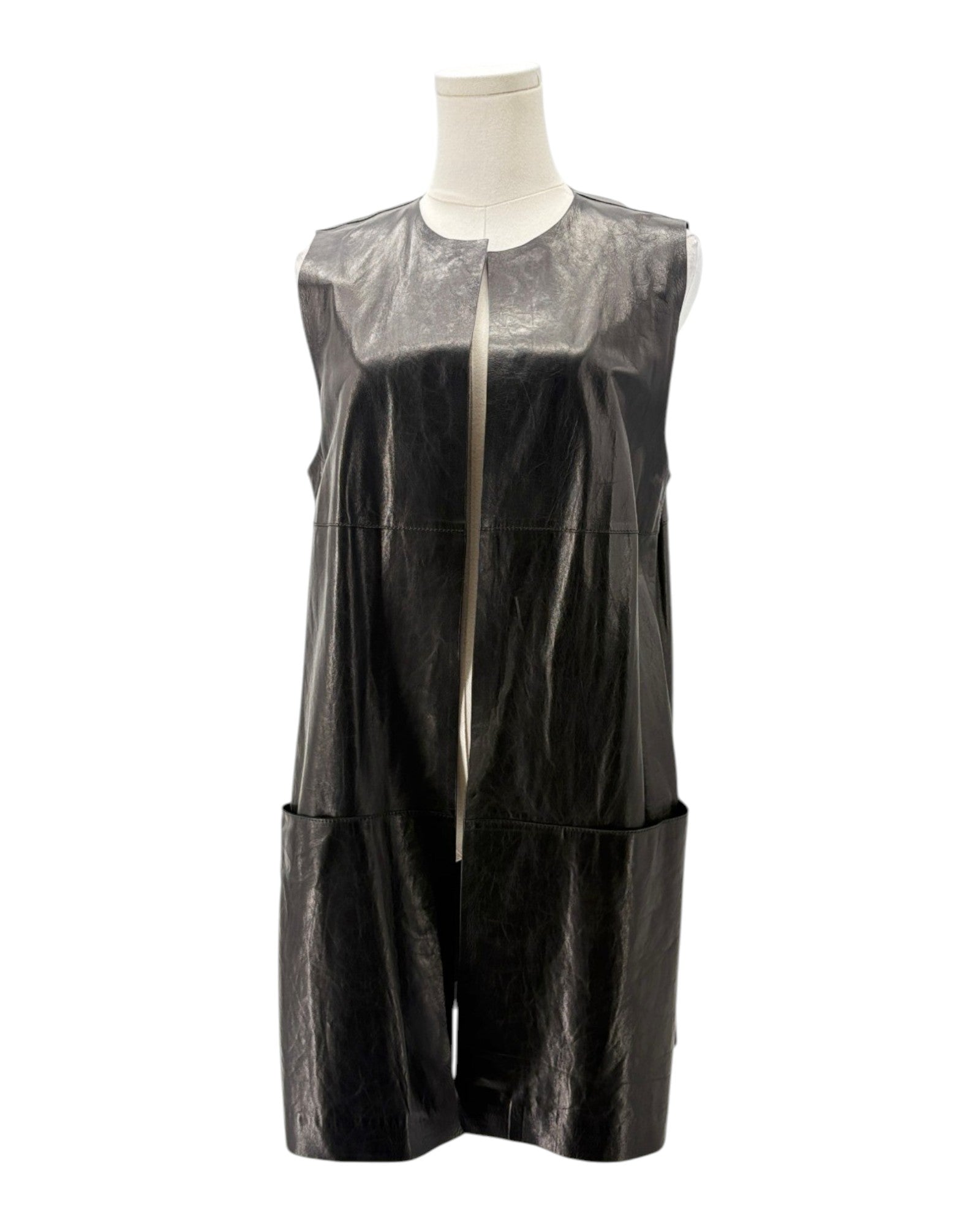 Black sleeveless dress with sheer overlay on a mannequin against a white background