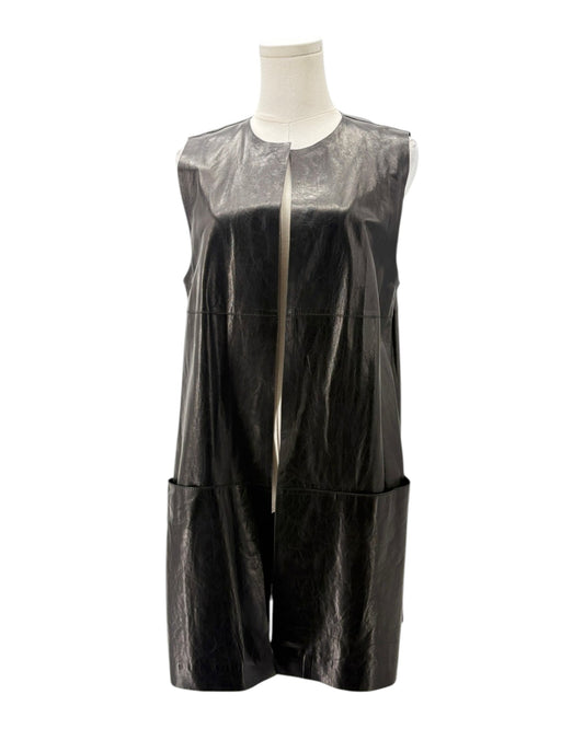 Black sleeveless dress with sheer overlay on a mannequin against a white background