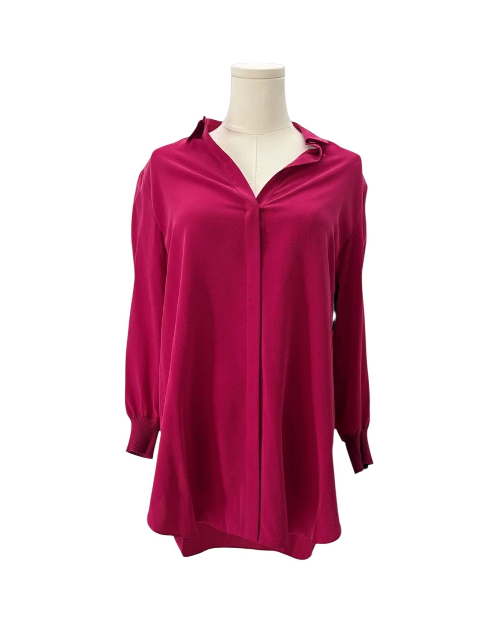 Pink blouse on a mannequin against a white background