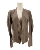 Brown jacket on a mannequin against a white background