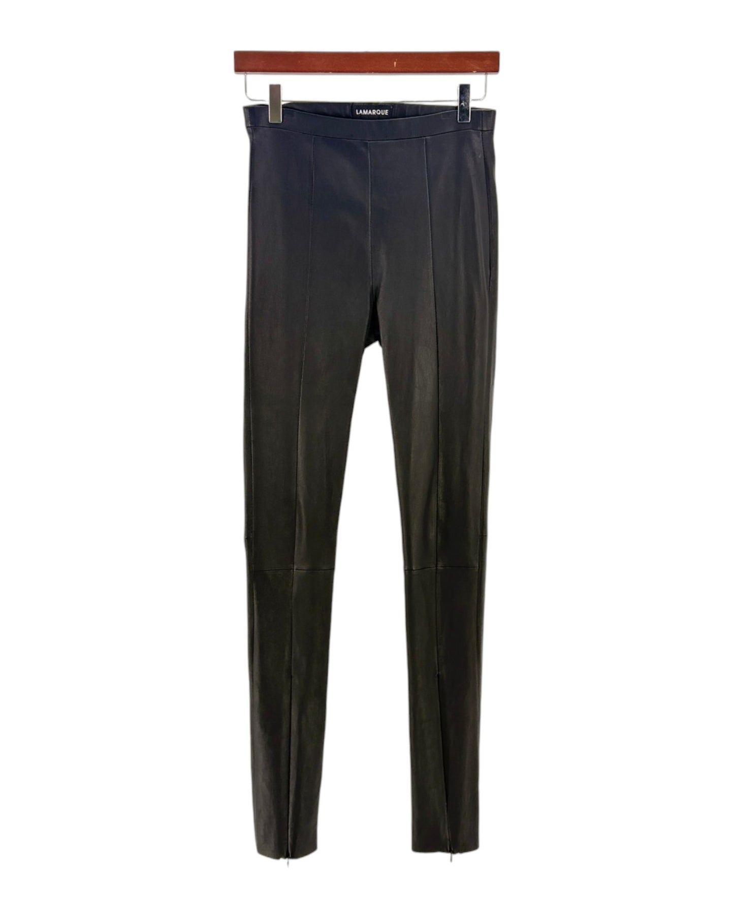 Black leather pants on a hanger with a white background