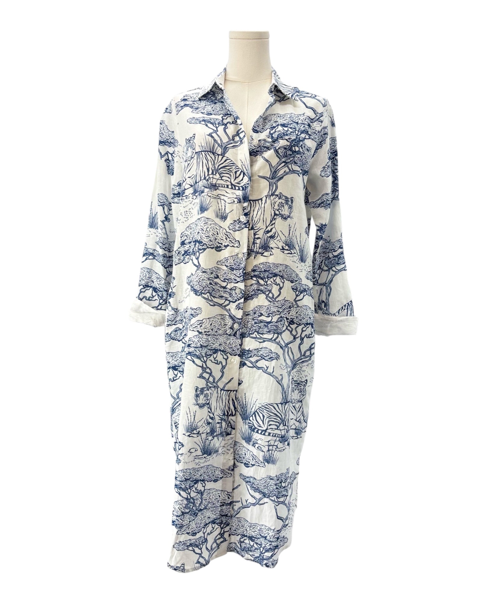 Mannequin wearing a blue and white patterned shirt on a white background