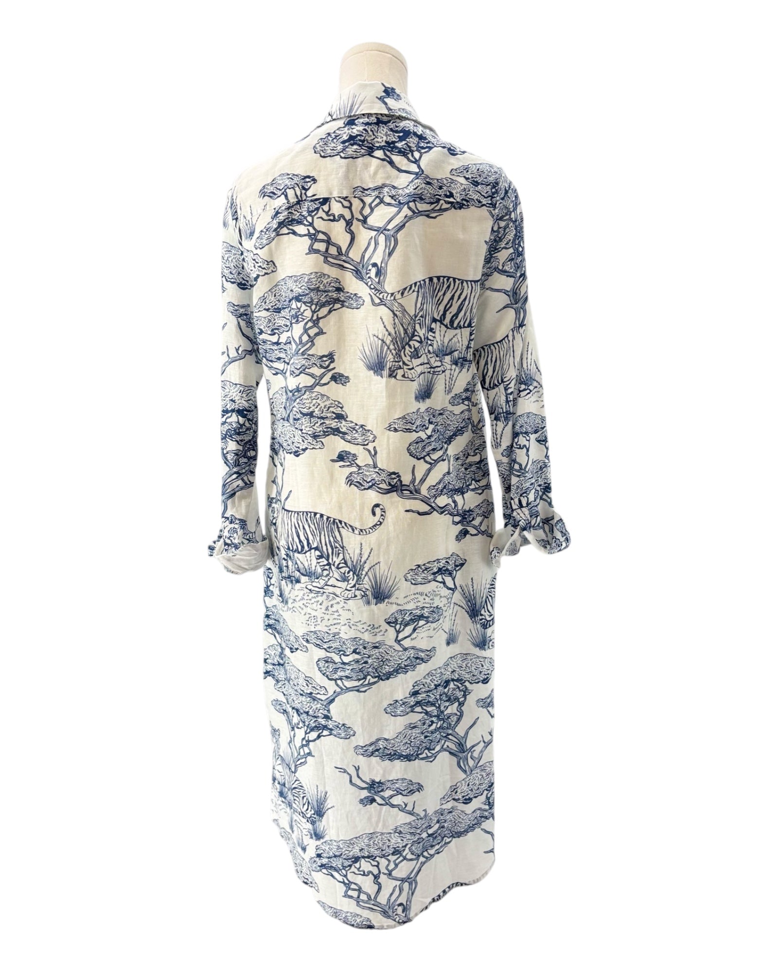 Long-sleeve dress with blue floral pattern on a mannequin against a white background