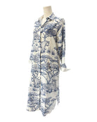 White dress with blue floral pattern on a mannequin against a white background