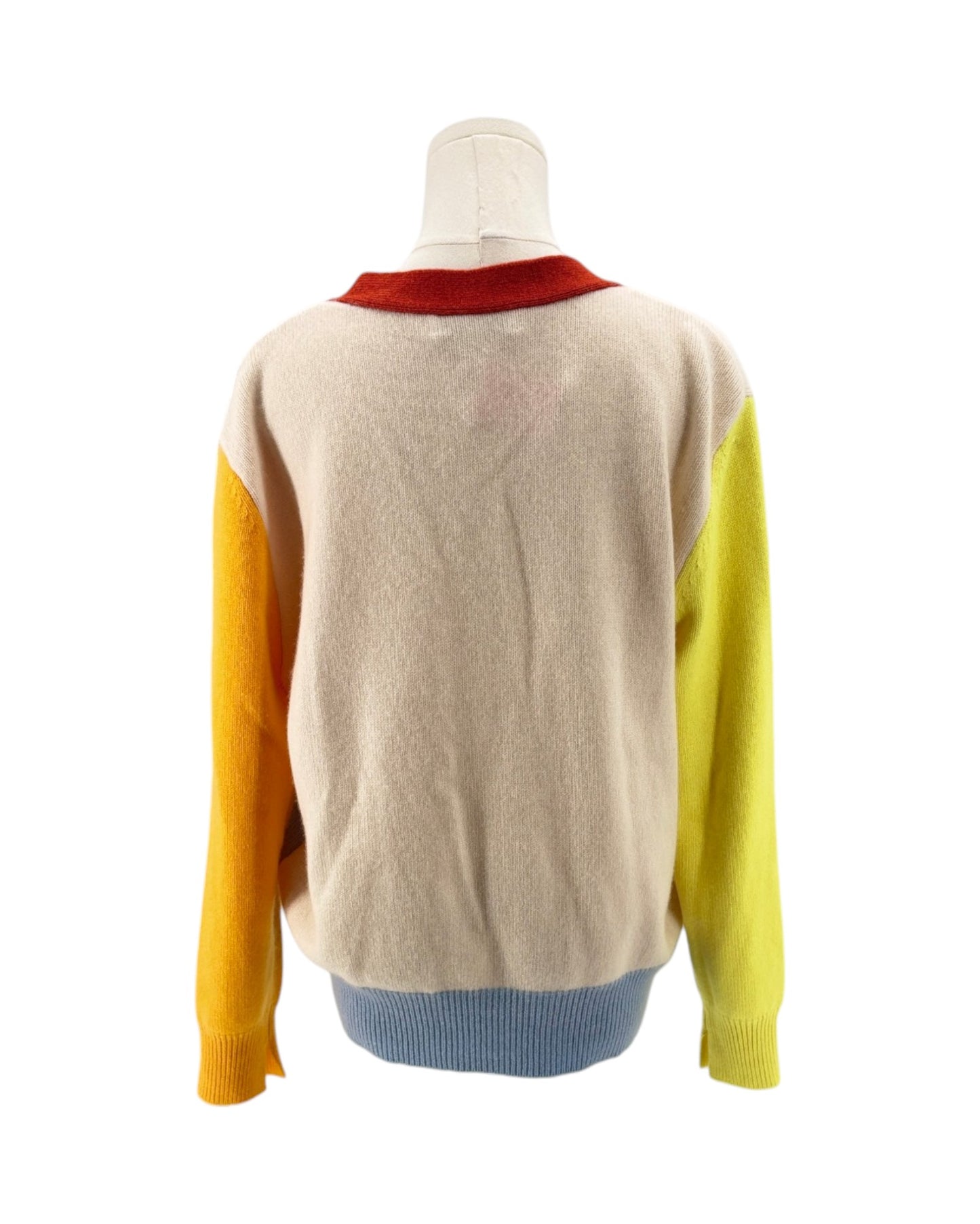 Color-blocked sweater on a mannequin against a white background