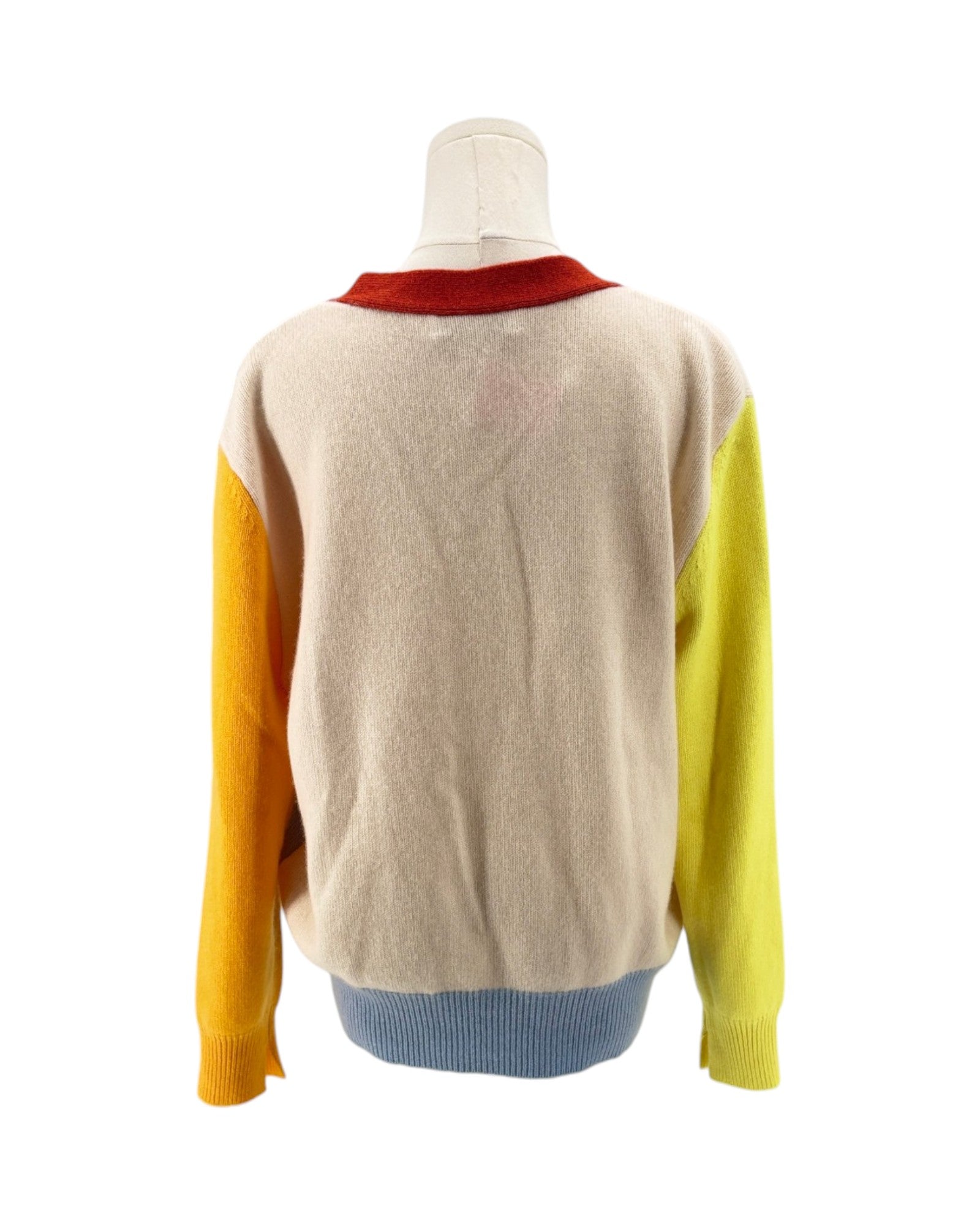 Color-blocked sweater on a mannequin against a white background