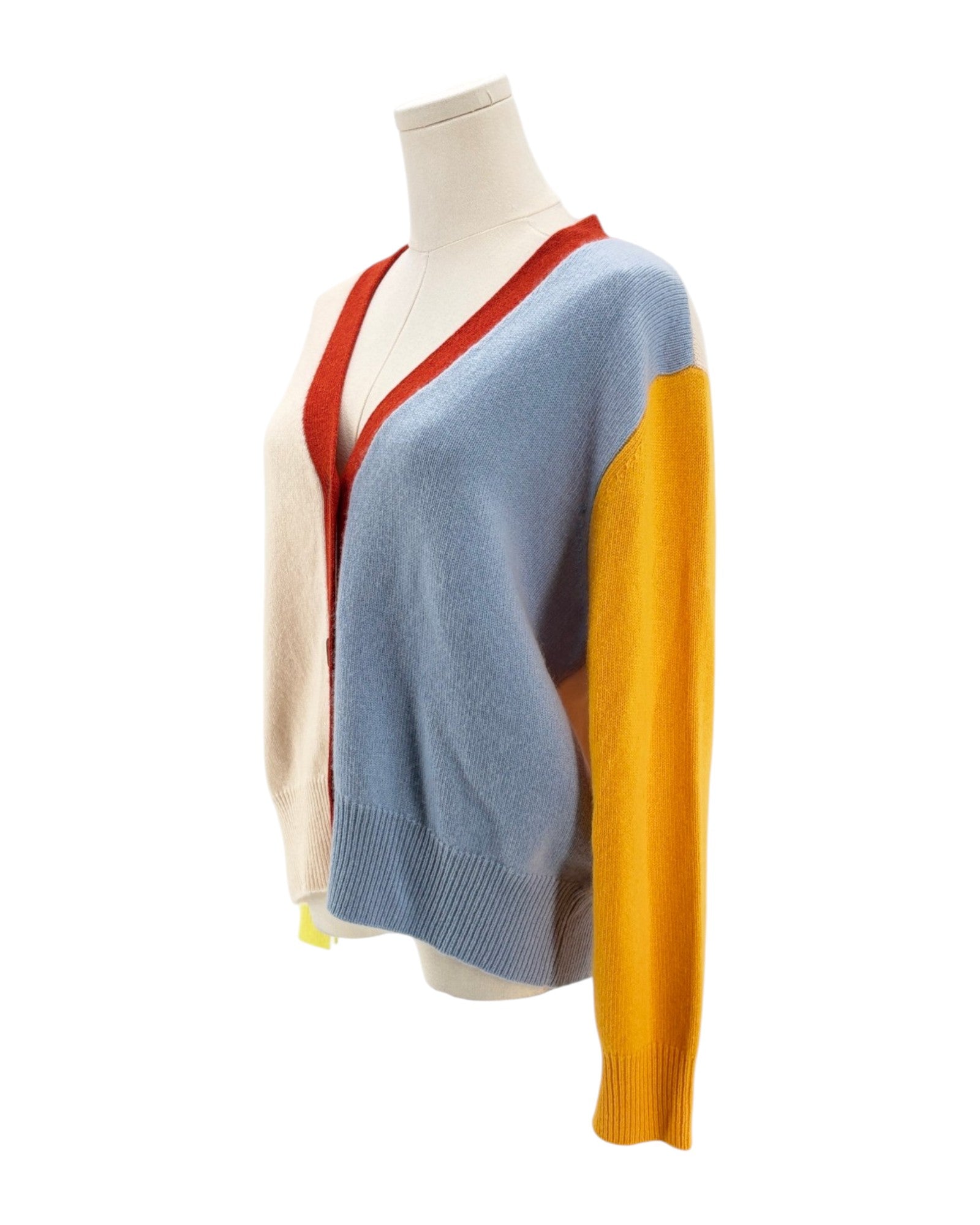 Color-blocked sweater on a mannequin against a white background