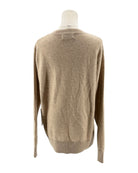 Beige sweater on a mannequin against a white background