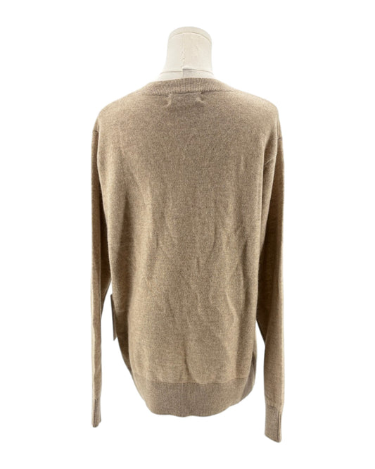 Beige sweater on a mannequin against a white background