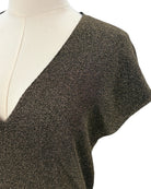 Metallic knit sleeveless top on a mannequin against a white background