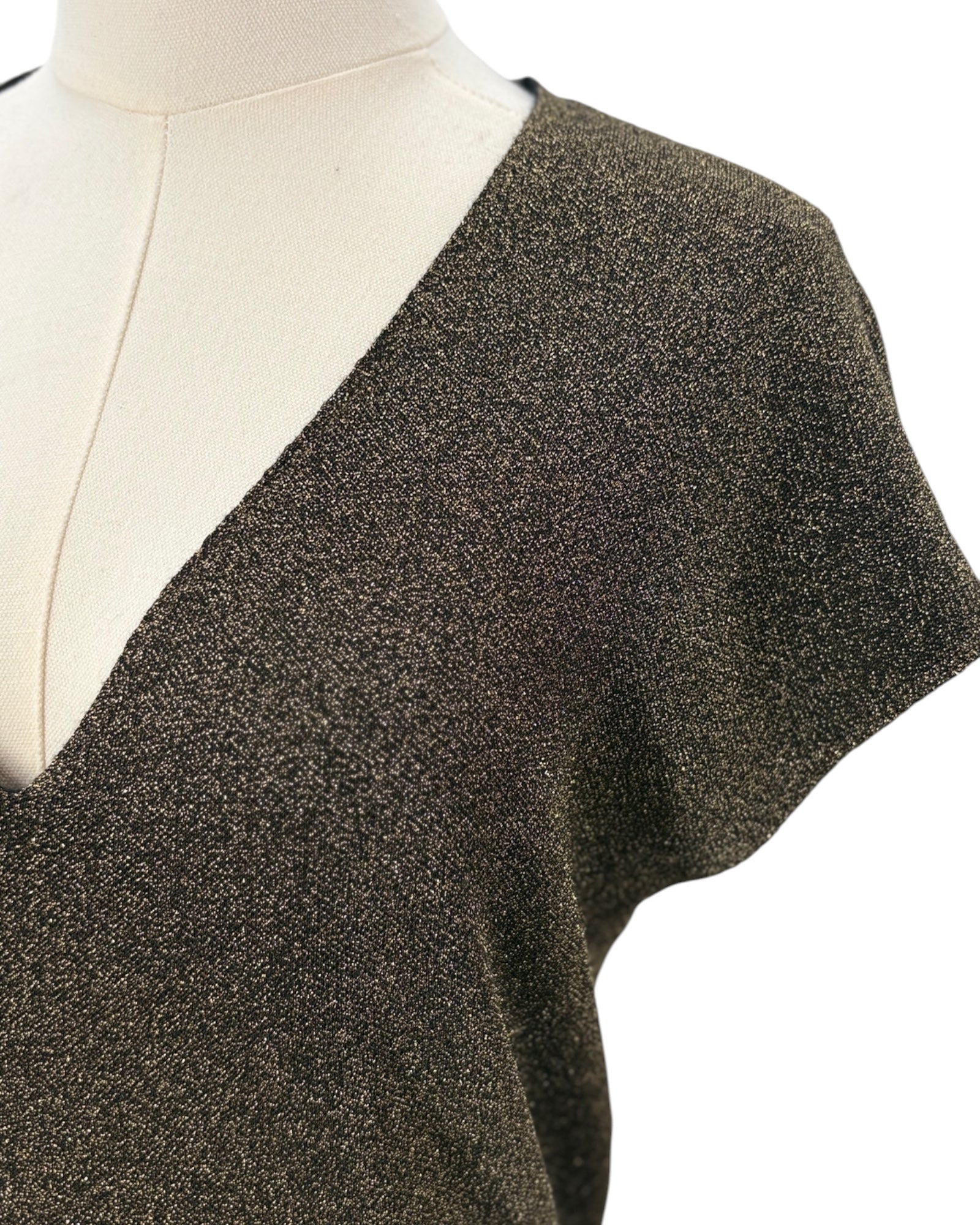 Metallic knit sleeveless top on a mannequin against a white background