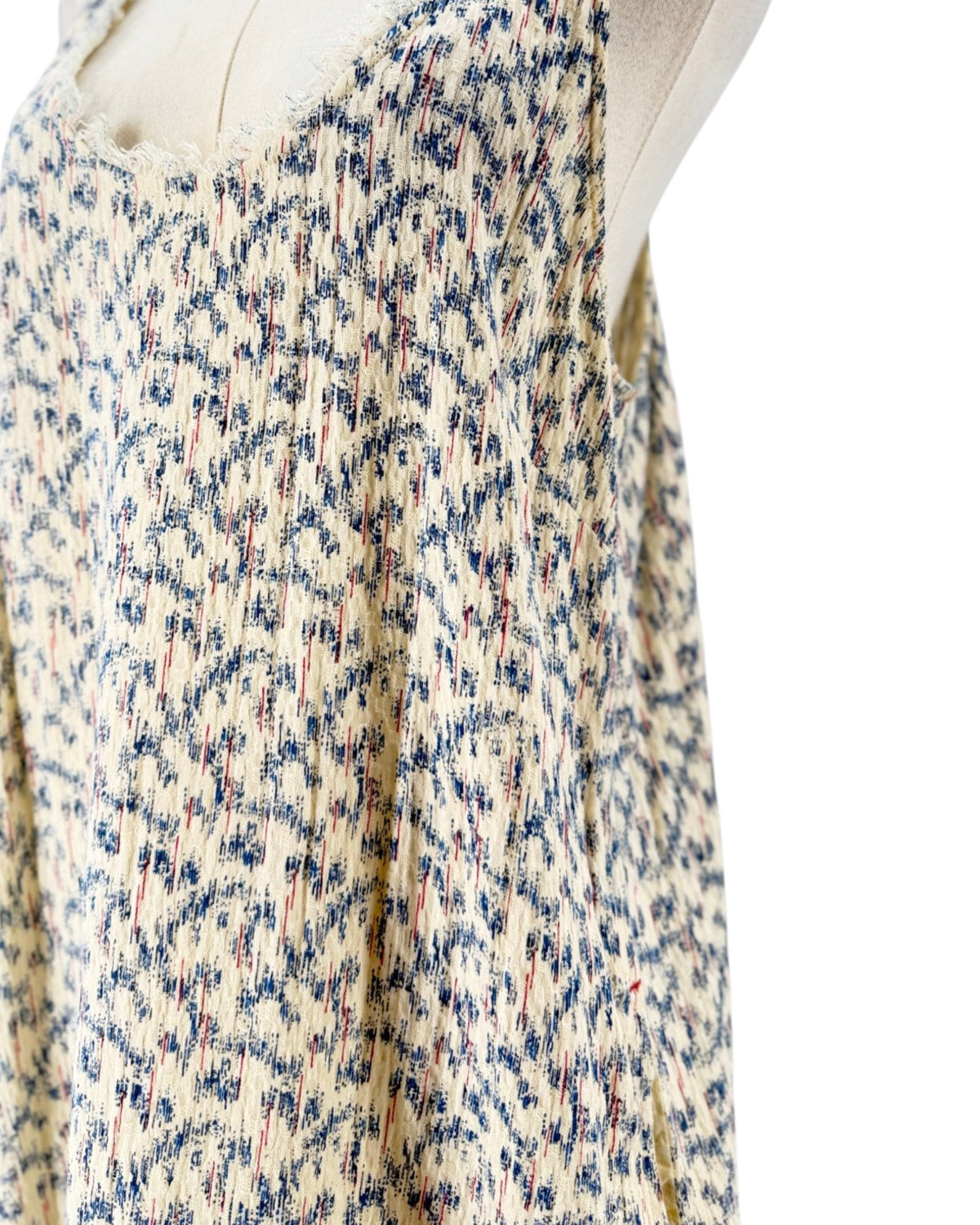 Multi color sleeveless midi dress on a mannequin on a white background
