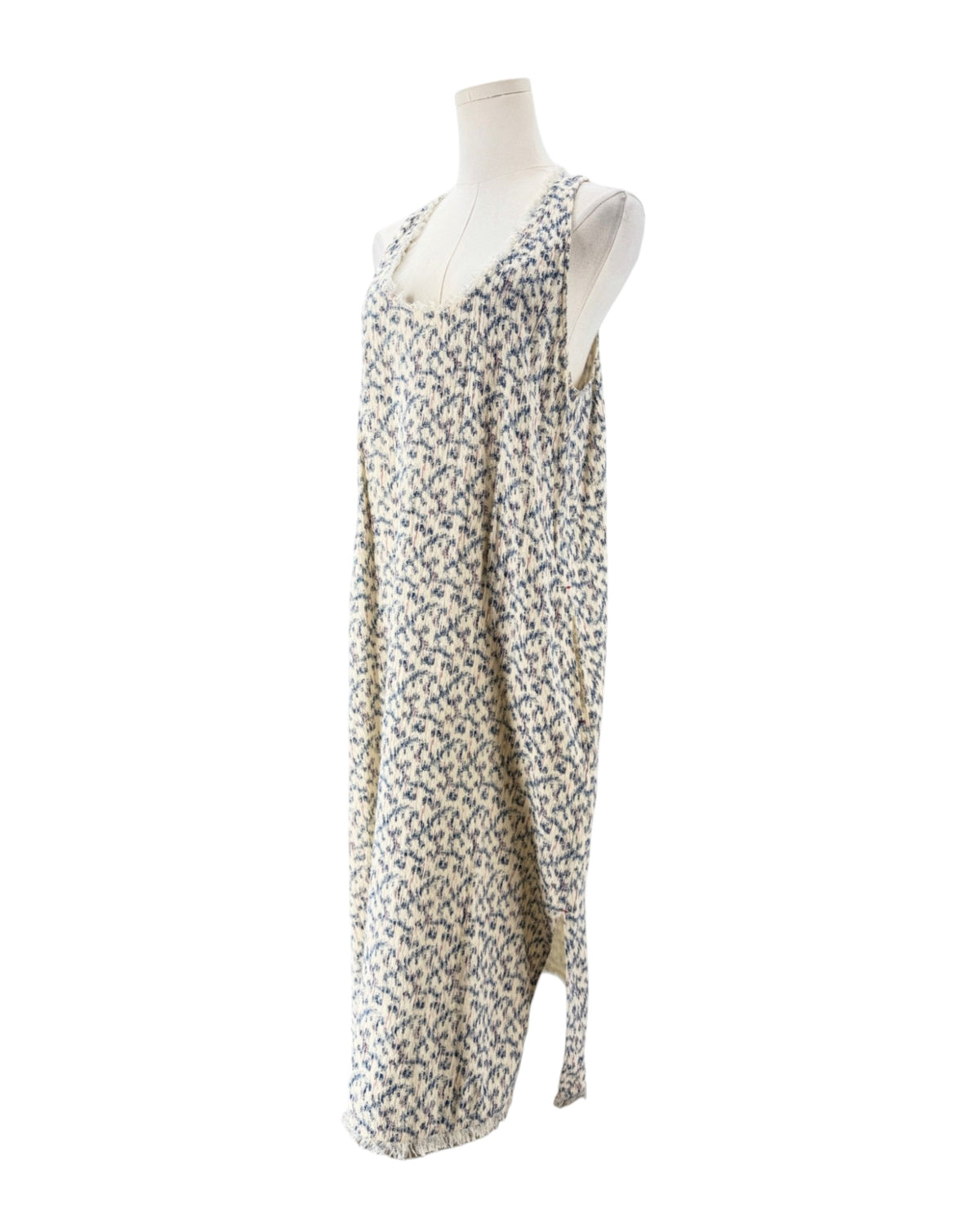 Multi color sleeveless midi dress on a mannequin on a white background