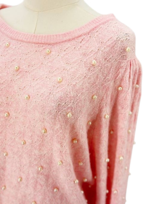 Lily Pulitzer pink sweater with pearl embellishments on a mannequin against a white background