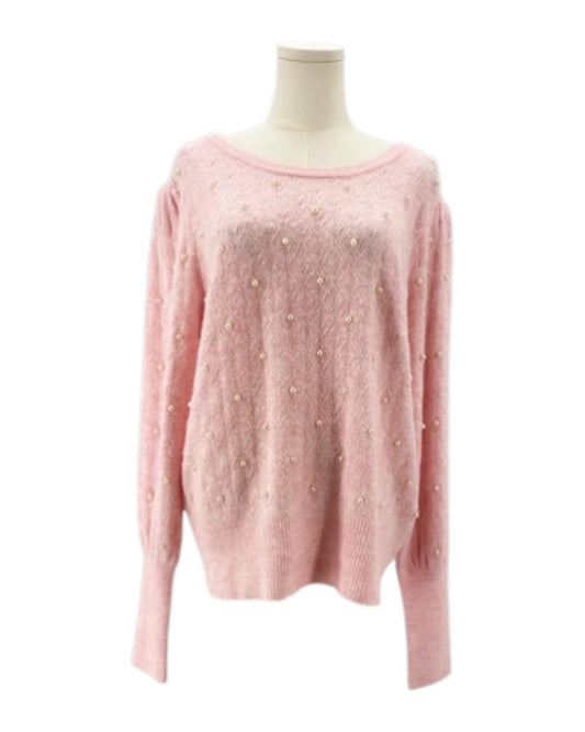 Lily Pulitzer pink sweater with pearl embellishments on a mannequin against a white background