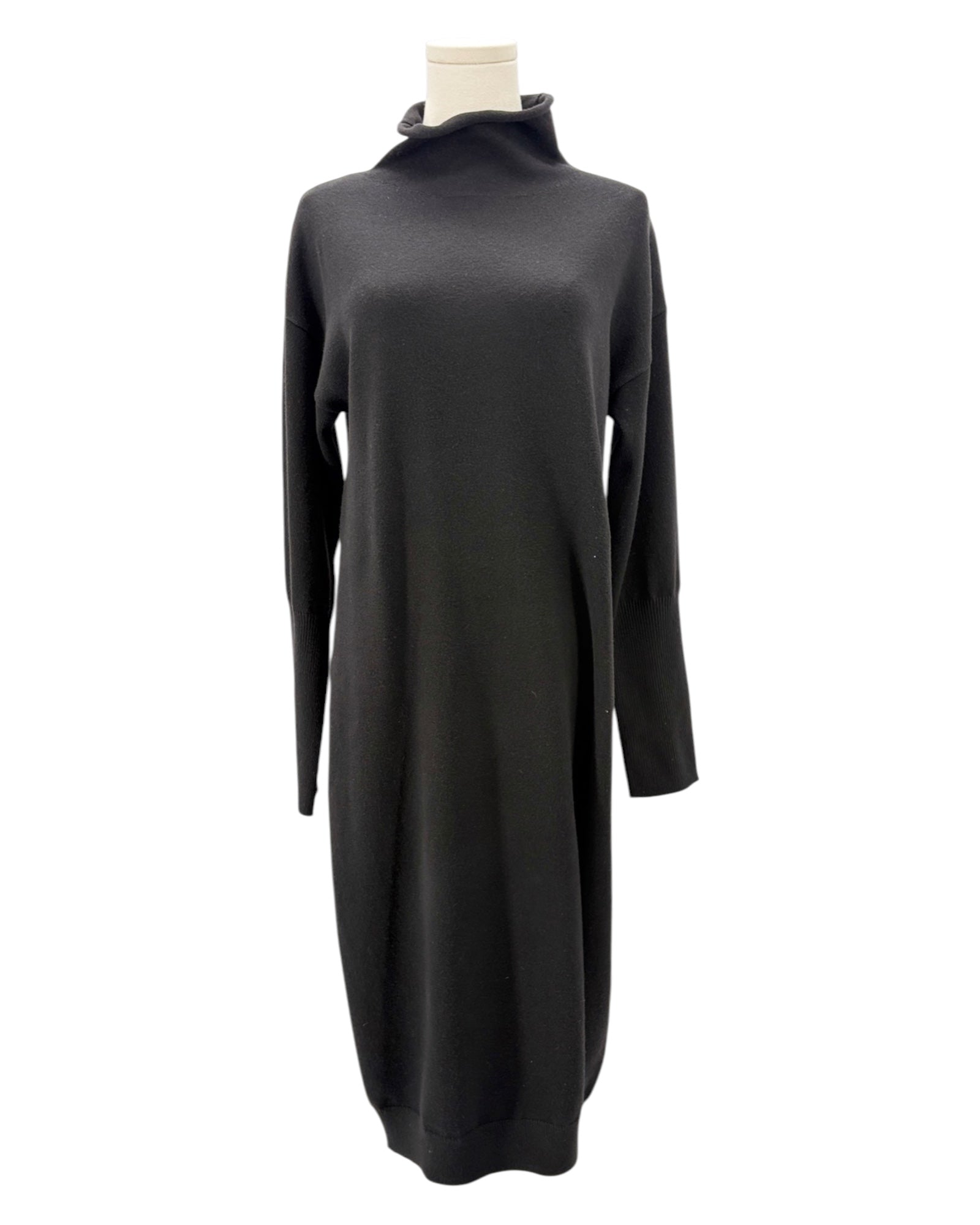 Black sweater dress on a mannequin against a white background