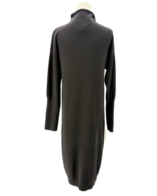 Black sweater dress on a mannequin against a white background
