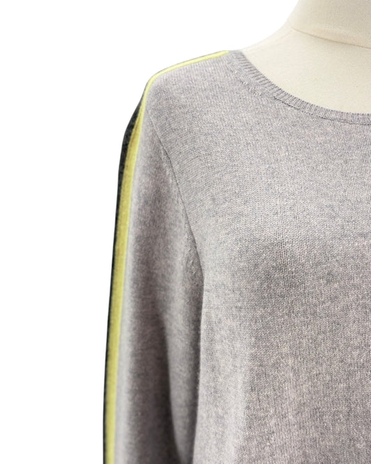Gray sweater with yellow trim on a mannequin against a white background