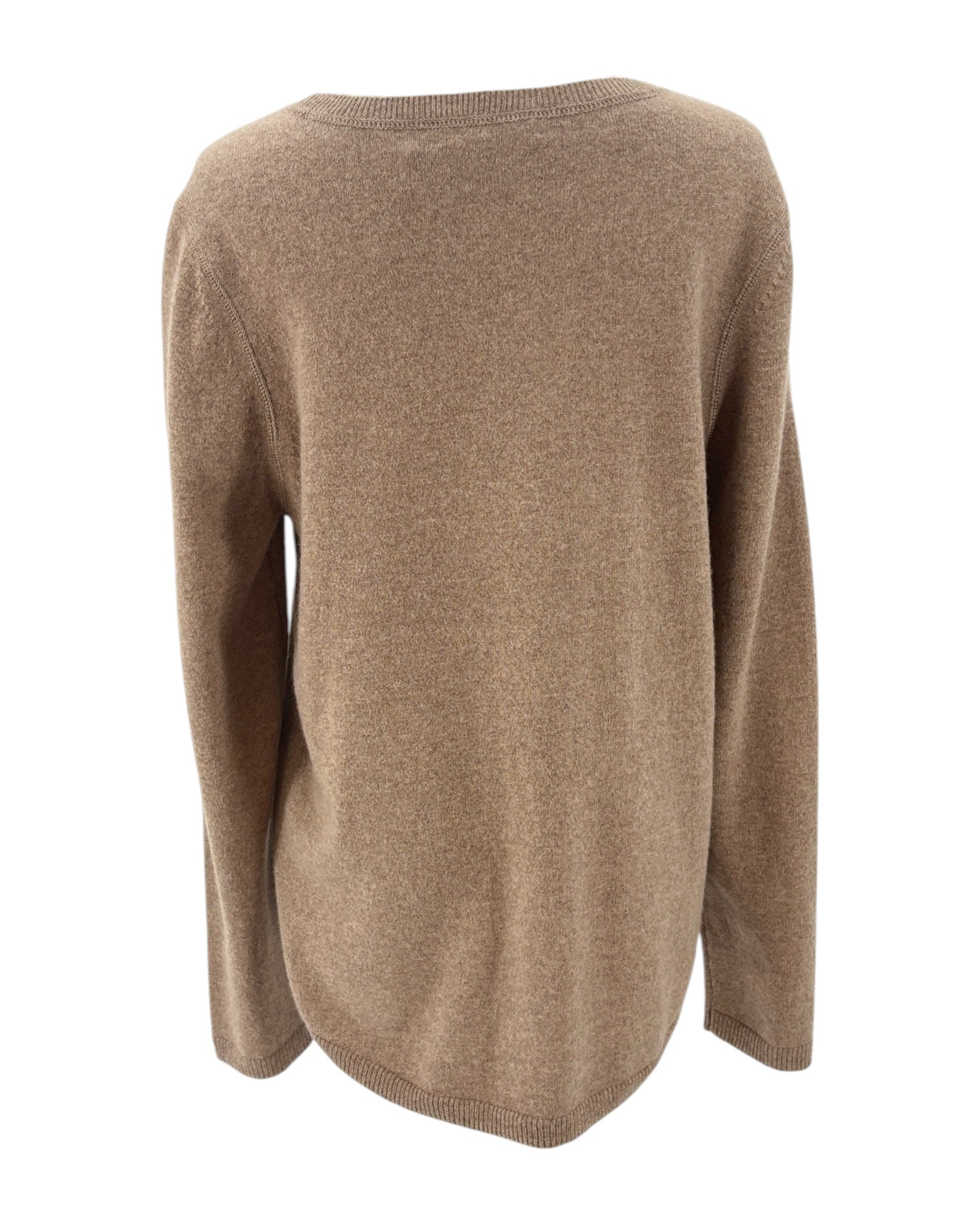 Tan sweater with colorful heart patterns on a mannequin against a white background