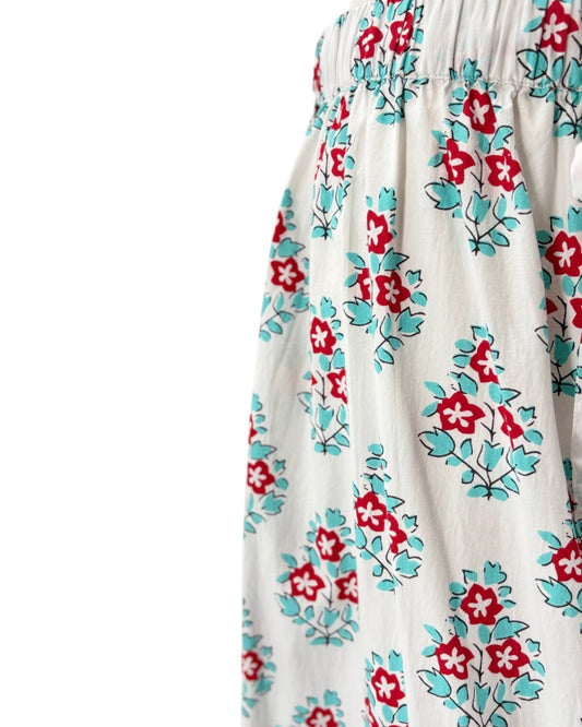 Floral patterned fabric with red and blue flowers on a white background