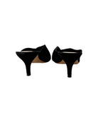 Pair of black high-heeled shoes on a white background