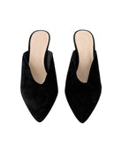 Pair of black pointed-toe mules on a white background